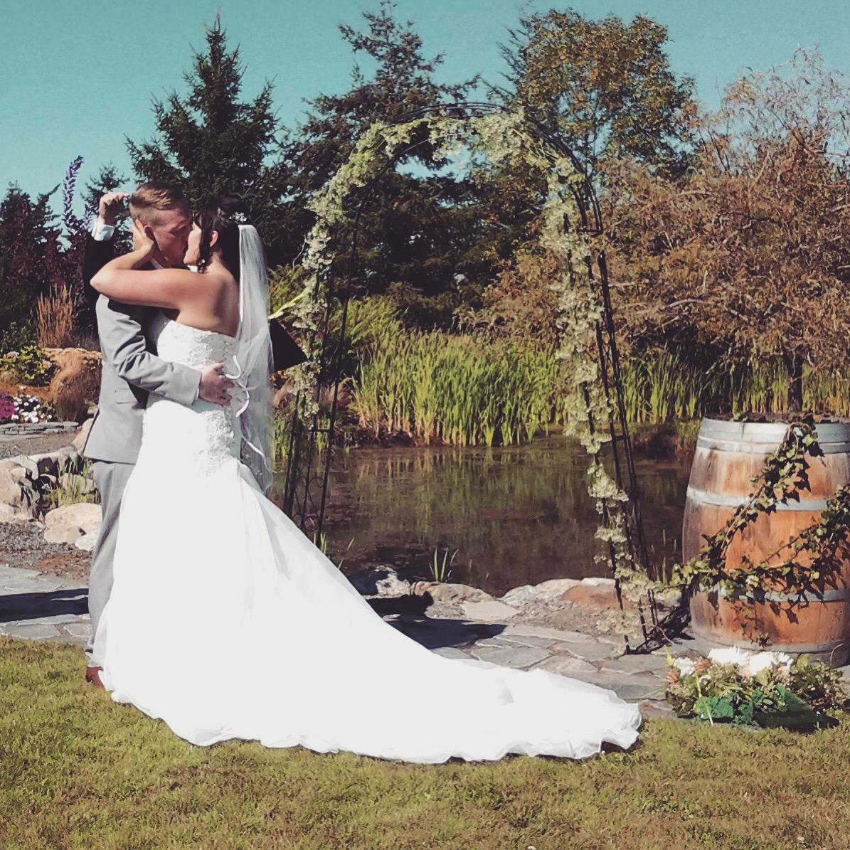 Stelsey wedding alter kiss